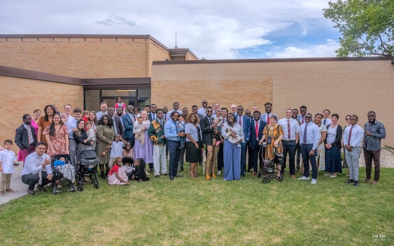 Members of the Lehi 35th Ward (French) in the Lehi Utah Central Stake pose for a photo outside the meeting house after a baby blessing on May 3, 2026, in Lehi, Utah.