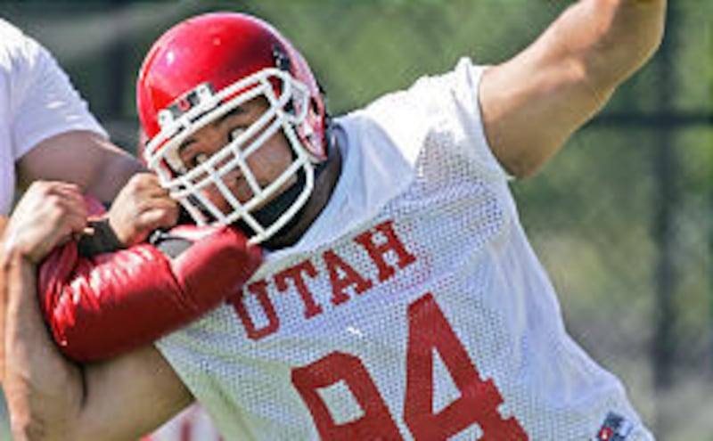 Utah defensive lineman Steve Fifita (94) powers through a pass-rush drill at practice Saturday. Fifita has been selected as a team captain.