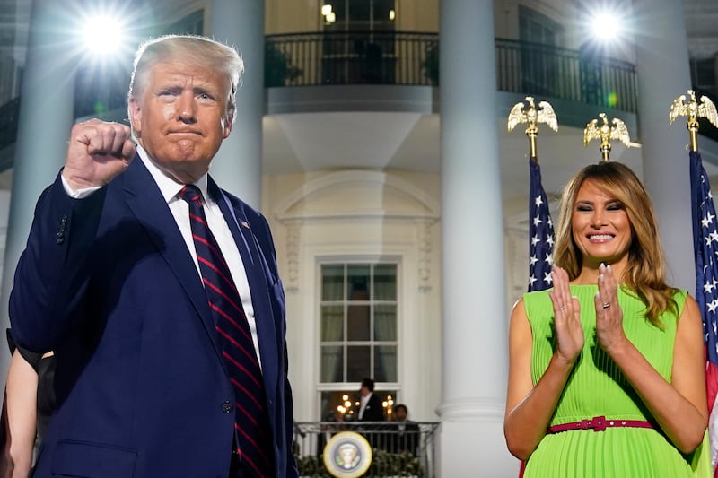 President Donald Trump and first lady Melania Trump stand on the South Lawn of the White House on the fourth day of the Republican National Convention, Thursday, Aug. 27, 2020, in Washington.