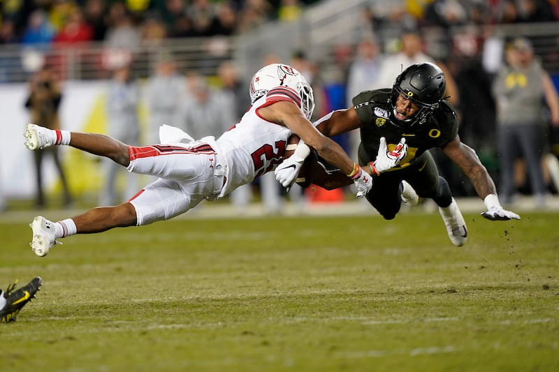 Oregon’s Jevon Holland breaks up a pass for Utah’s Jaylen Dixon during Pac-12 championship game in Santa Clara, Calif.