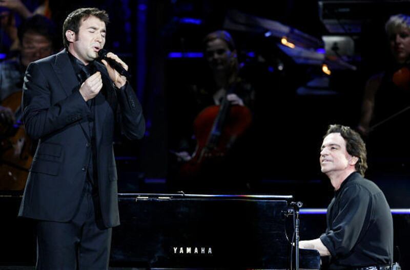 Nathan Pacheco, left, and Yanni perform during the "Voices" tour Wednesday at EnergySolutions Arena.