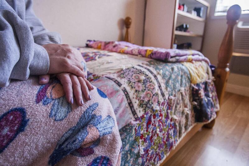 One of the clients at the South Valley Sanctuary sits in her room Monday, Dec., 10, 2012, where she and her young child stay. The sanctuary is a private domestic violence shelter that was awarded a SelectHealth Select 25 award in 2012.