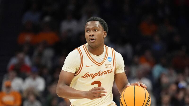 Texas guard Max Abmas brings the ball down court against Colorado State during NCAA Tournament game, Thursday, March 21, 2024, in Charlotte, N.C.