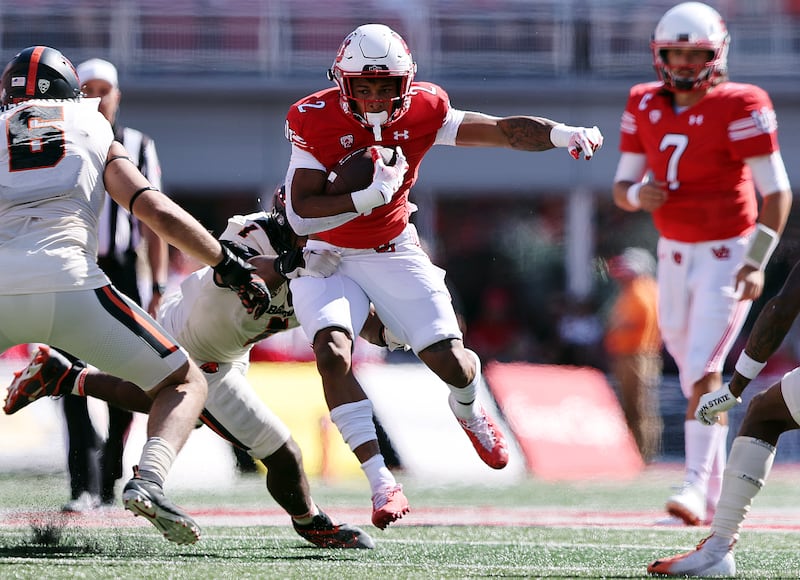 Utah running back Micah Bernard looks looks for yardage against Oregon State at Rice-Eccles Stadium in Salt Lake City.