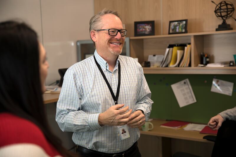 Kevin Ricklefs, senior vice president of talent management for CHG Healthcare, chats with co-workers in his office in Midvale. For the 10th straight year, CHG Healthcare has made Fortune magazine’s “100 Best Companies to Work For” list, ranking it among t