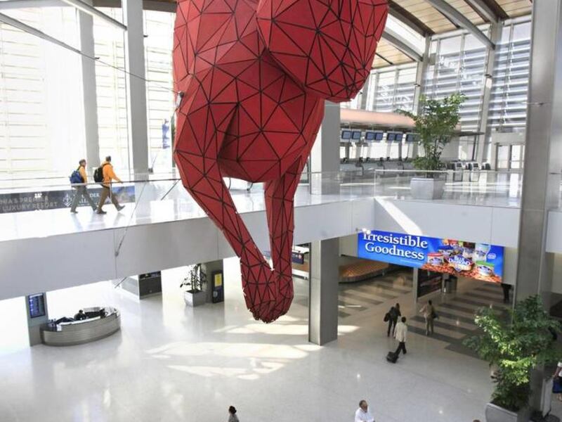The $800,000 sculpture, titled "Leap," is suspended by seven cables affixed to steel girders at the Sacramento International Airport.