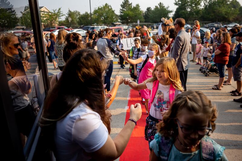 Students are given the red-carpet treatment as they arrive for the first day of school at Altara Elementary in Sandy on Monday, Aug. 16, 2021.