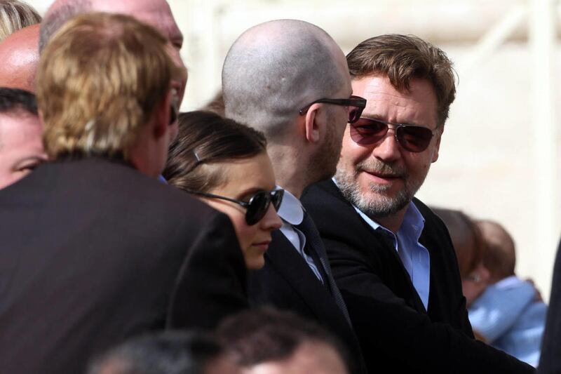 Actor Russell Crowe, right, attends Pope Francis' general audience in St. Peter's Square at the Vatican, Wednesday, March 19, 2014. Crowe and the makers of the big-budget film "Noah" attended Pope Francis' general audience Wednesday but didn't get what th