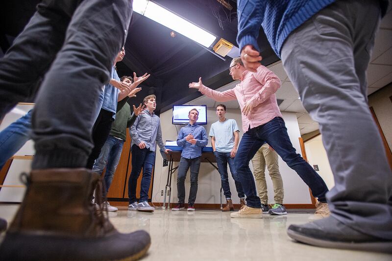 McKay Crockett, producer and artistic director for BYU's Vocal Point works with the group during rehearsal at the Harris Fine Arts Center in Provo on Friday, Jan. 18, 2019.