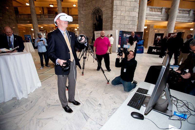 Lt. Gov. Spencer Cox tries a Dell virtual reality computer game during Tech Day on the Hill at the state Capitol in Salt Lake City on Monday, Feb. 25, 2019.
