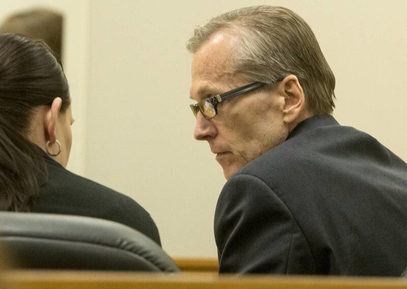 Defense attorney Kara North talks to Martin MacNeill during his trial on forcible sexual abuse in Provo, Wednesday, July 2, 2014.