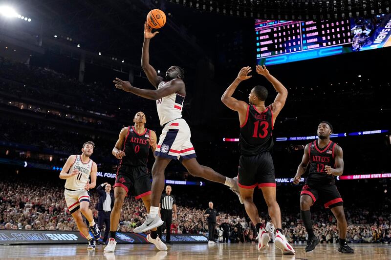 Connecticut forward Adama Sanogo scores during the national championship game against San Diego State on Monday, April 3, 2023.