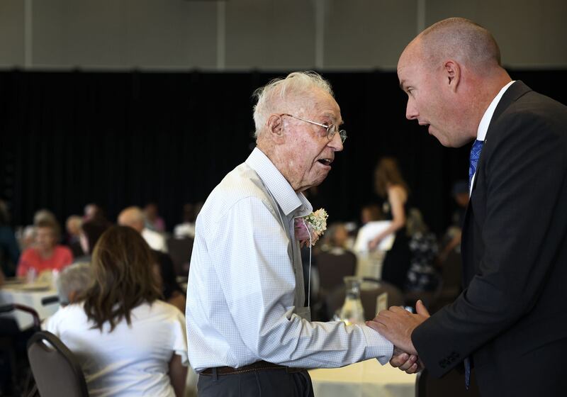 Weldon Heaton, 101, chats with Gov. Spencer Cox at the Viridian Event Center in West Jordan on Thursday, Aug. 4, 2022.