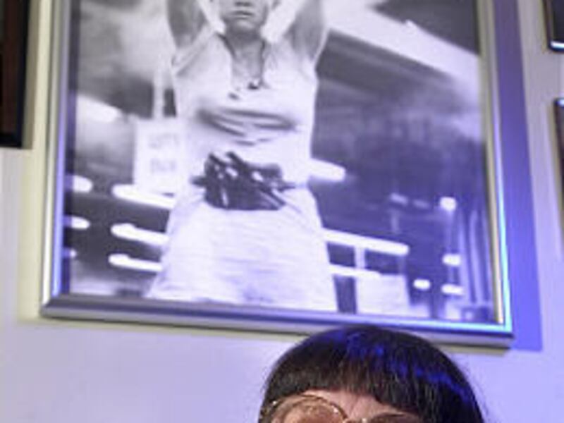 A photo of Sally Fields in the movie "Norma Rae" hangs in Crystal Lee Sutton's home in August 2001 in Burlington, N.C. The character in the movie was based on Sutton, who helped organize workers at the J.P. Stevens plant in Roanoke Rapids.