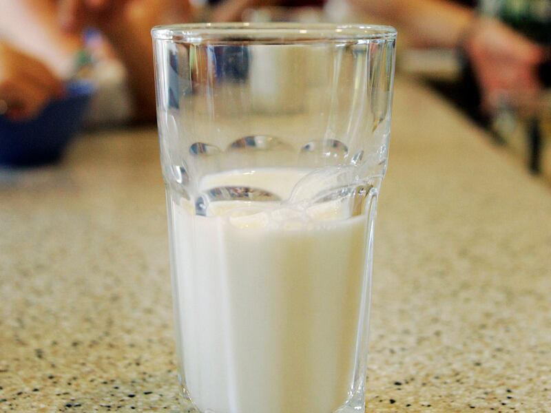 FILE - This June 8, 2007 file photo shows a glass of milk on a table during a family breakfast in Montgomery, Ala. Nearly 20 years ago, about nearly half of high school students said they drank at least one glass of milk a day. But now it’s down to less t