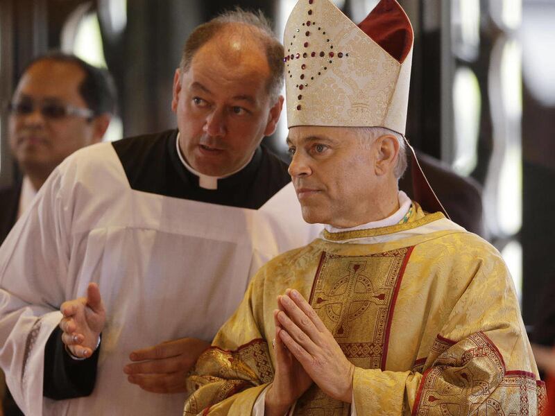 Salvatore J. Cordileone, right, waits to be introduced during a ceremony to install him as the new archbishop of San Francisco at the Cathedral of St. Mary of the Assumption in San Francisco, Thursday, Oct. 4, 2012.
