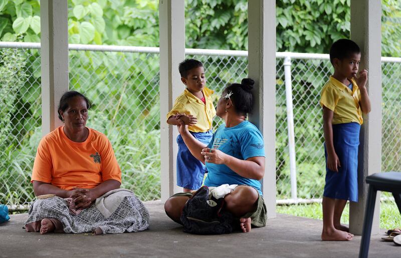 Fa'amele Fa'atuai talks with her son Lupi following lunch at Foundational Learning preschool at the Siumu Ward in Siumu, Samoa, on Thursday, May 16, 2019.