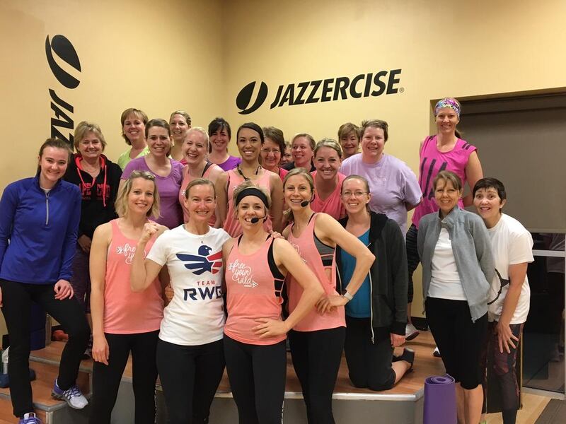 Amy Donaldson, center in white, and her sister-in-law, Tonya Donaldson, right with a headset on, enjoy an early morning Jazzercise class. Tonya Donaldson said her life was transformed in a number of ways once she started attending the classes. She now own