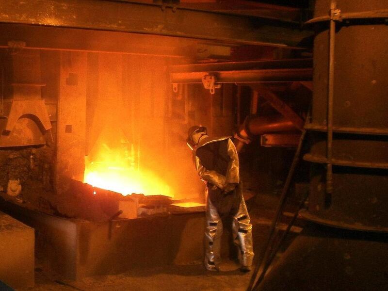 In this undated photo provided by Asarco, an employee at Asarco's smelter in Hayden, Ariz. works to process copper concentrates. The smelter has operated since 1912. Tucson-based copper-mining giant Asarco will celebrate more than 100 years of operations