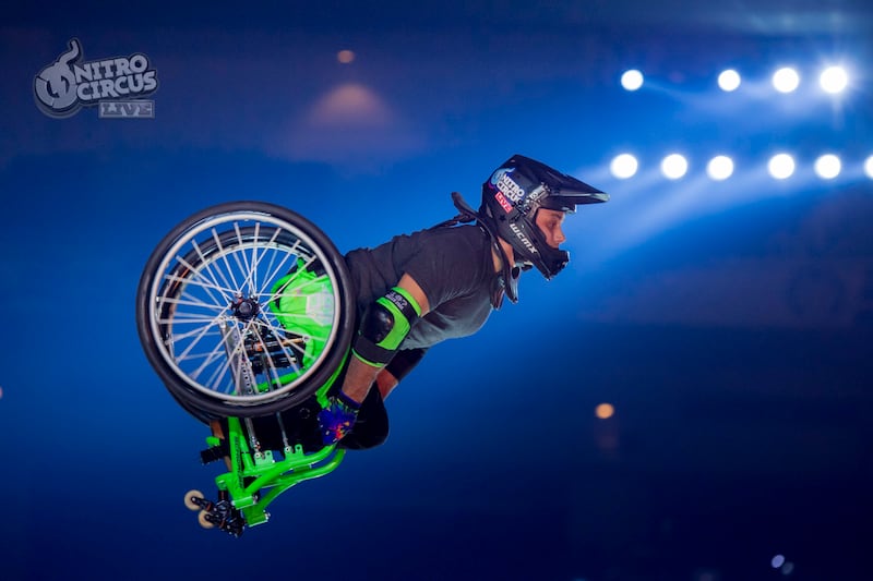 Aaron "Wheelz" Fotheringham, who has spina bifida, performs a stunt in his wheelchair during a Nitro Circus event in Japan in 2017.