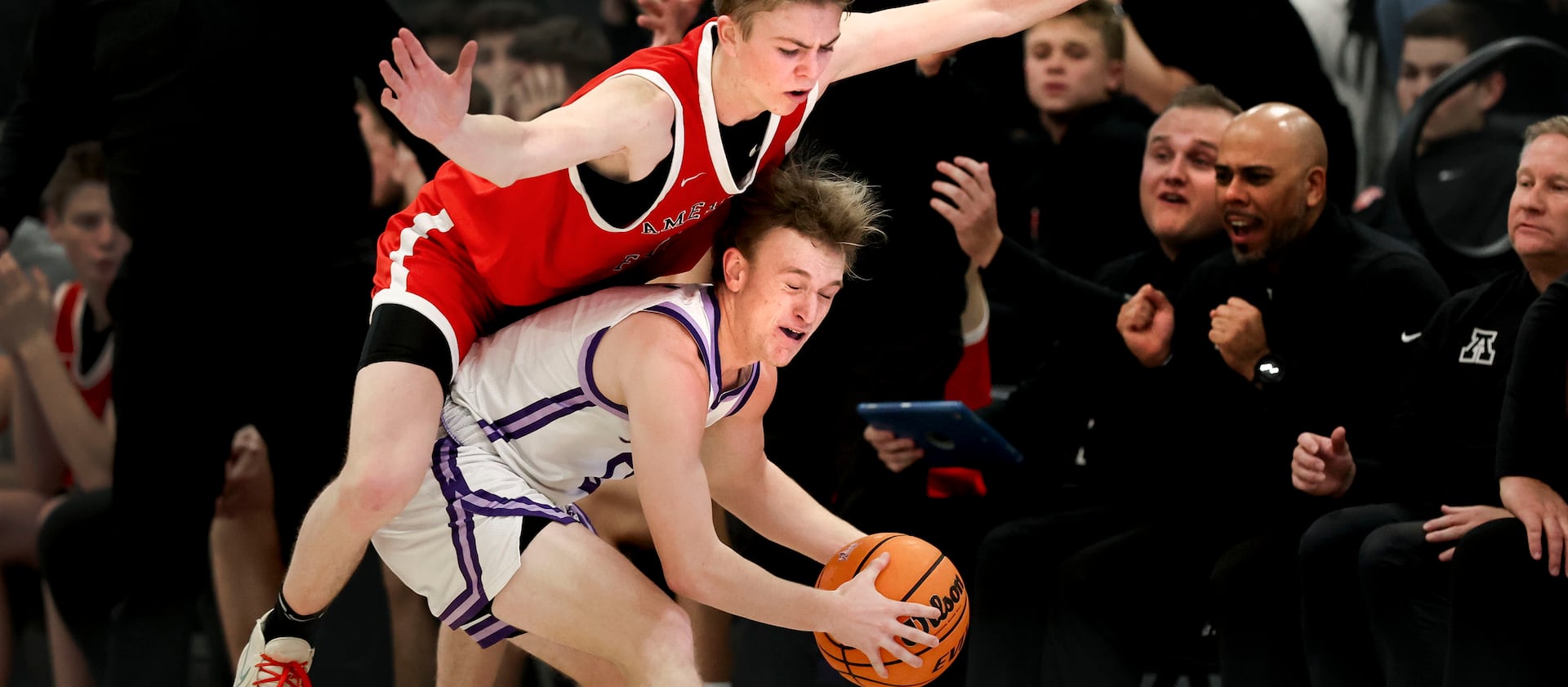 American Fork’s Tiger Cuff falls onto Lehi’s Jace John at Lehi High School on Friday, Jan. 12, 2024.
