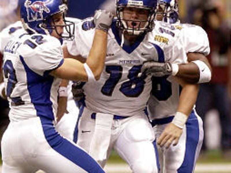 Memphis quarterback Danny Wimprine, center, celebrates with teammates after scoring a touchdown against North Texas Tuesday in the New Orleans Bowl.