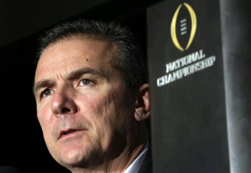 Ohio State head coach Urban Meyer listens to a question during a news conference after the NCAA college football playoff championship game Tuesday, Jan. 13, 2015, in Dallas. Ohio State defeated Oregon 42-20 on Monday. (AP Photo/David J. Phillip)