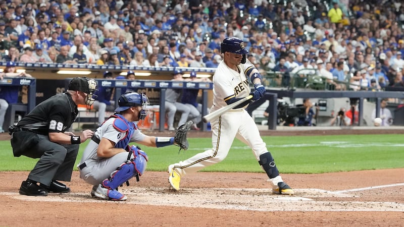Milwaukee Brewers’ Mario Feliciano hits a single during the sixth inning of a game against the Los Angeles Dodgers.