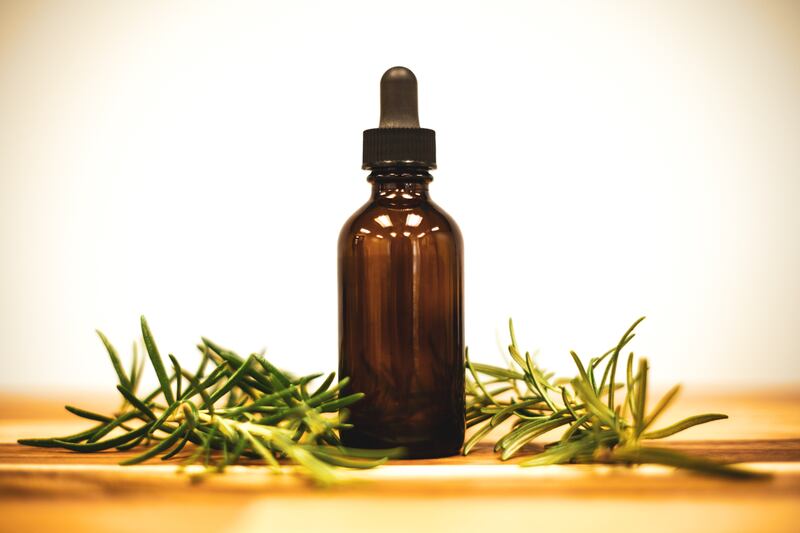 Rosemary oil and rosemary herb pictured.