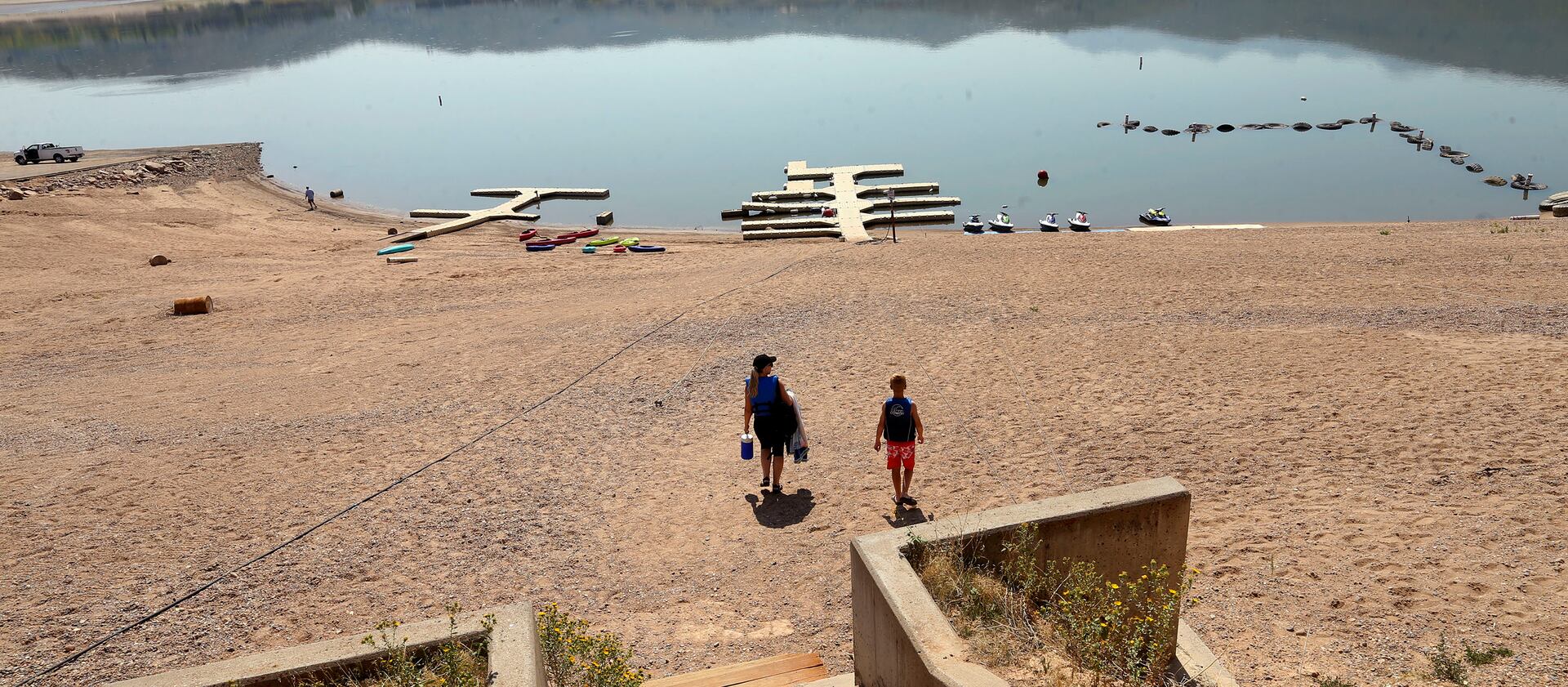 People walk to the water at Pineview Reservoir near Huntsville, Weber County.