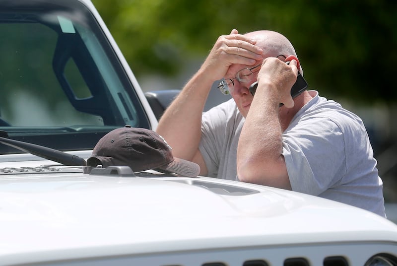 The Elizabeth Shelley's great-grandfather by marriage makes a phone call while police search for the 5-year-old in the backyards of nearby homes in Logan on Wednesday, May 29, 2019. She was last seen about 2 a.m. Saturday, May 25, 2019.