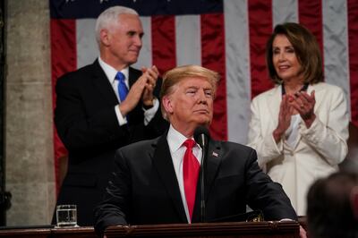 President Donald Trump gives his State of the Union address to a joint session of Congress, Tuesday, Feb. 5, 2019 at the Capitol in Washington, as Vice President Mike Pence, left, and House Speaker Nancy Pelosi look on.