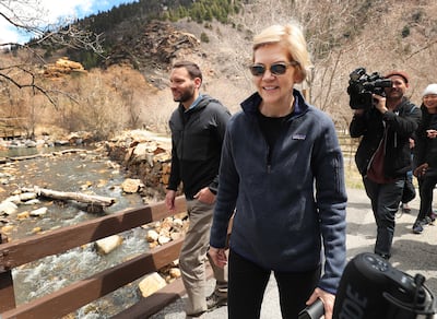 Sen. Elizabeth Warren, D-Mass., walks with Carl Fisher, of Save Our Canyons, at Storm Mountain picnic area in Big Cottonwood Canyon on Wednesday, April 17, 2019.
