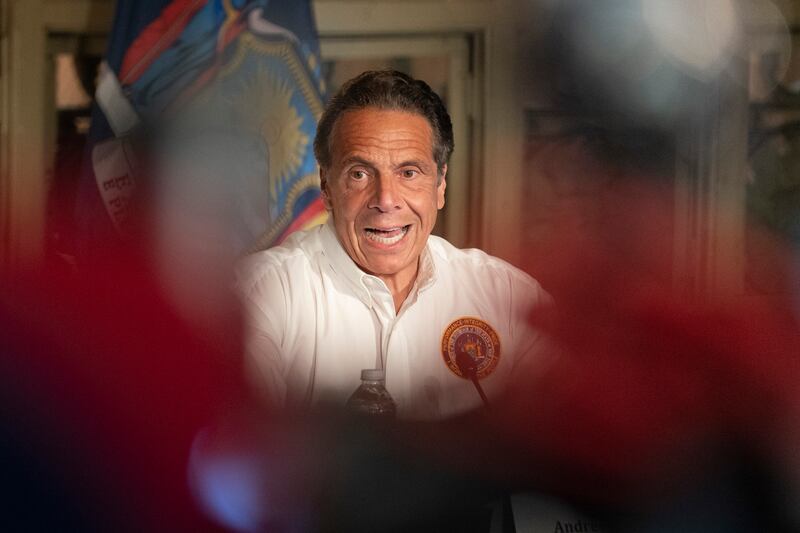 New York Gov. Andrew Cuomo is shown on a TV monitor.
