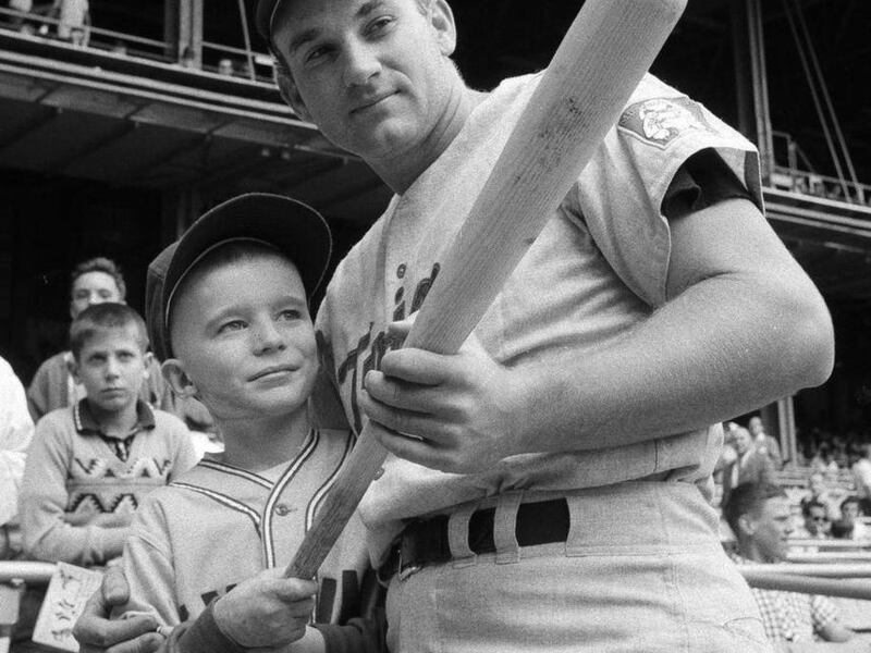 This Sept. 12, 1964, file photo shows Minnesota Twins' Harmon Killebrew  posing with 9-year-old Johnny Guiney, at New Yorks Yankee Stadium. Killebrew had visited Guiney in May after he was hospitalized with critical burns suffered when his altar boy robes