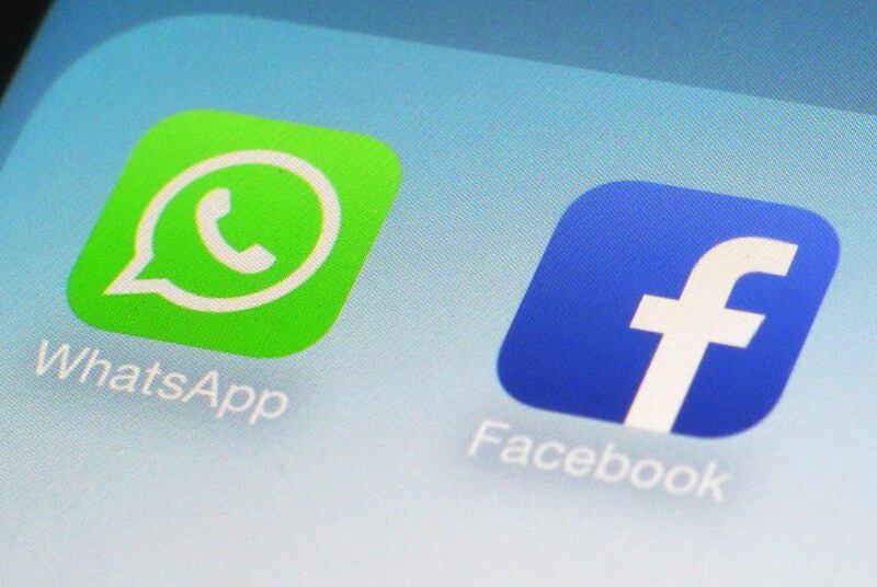 FILE - This Feb. 19, 2014, file photo, shows WhatsApp and Facebook app icons on a smartphone in New York. WhatsApp says on Tuesday, April 5, 2016, it's now using a powerful form of encryption to protect the security of photos, videos, group chats and voi