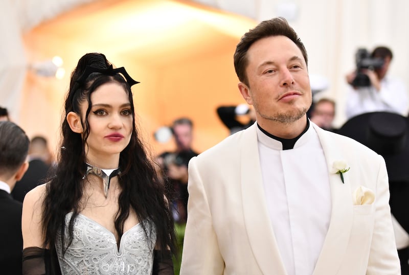 Grimes, left, and Elon Musk attend The Metropolitan Museum of Art’s Costume Institute benefit gala celebrating the opening of the Heavenly Bodies: Fashion and the Catholic Imagination exhibition on Monday, May 7, 2018, in New York. (Photo by Charles Sykes/Invision/AP)