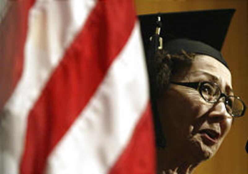 Mary Nomura, 80, sings during a graduation ceremony in L.A. Sunday.