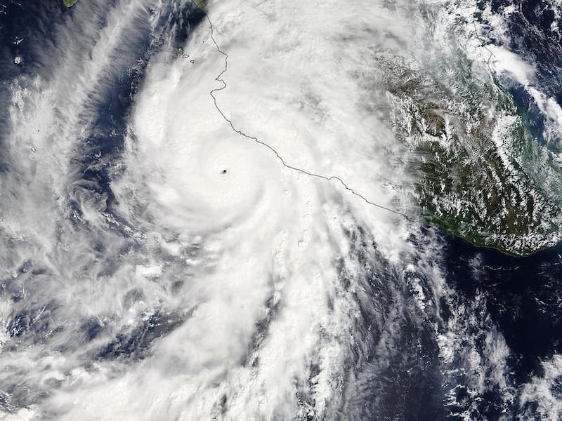 This satellite image taken at 1:30 p.m. EDT on Friday, Oct. 23, 2015, and released by NASA, shows the eastern quadrant and pinhole eye of Hurricane Patricia moving towards southwestern Mexico. The Category 5 storm is strongest ever in the Western Hemisphe