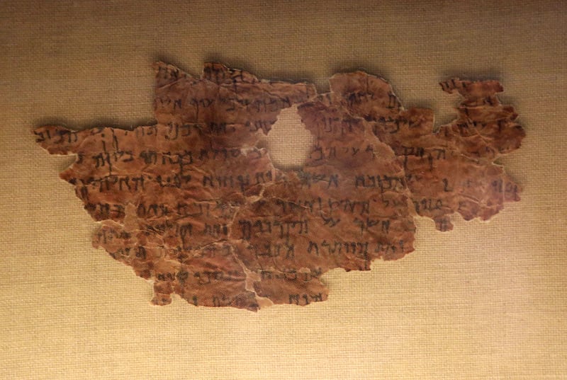 A fragment of the Dead Sea Scrolls with text from the book of Jubilees is on display in the exhibit Dead Sea Scrolls: Life and Faith in Ancient Times at The Leonardo in Salt Lake City on Thursday, Nov. 21, 2013.