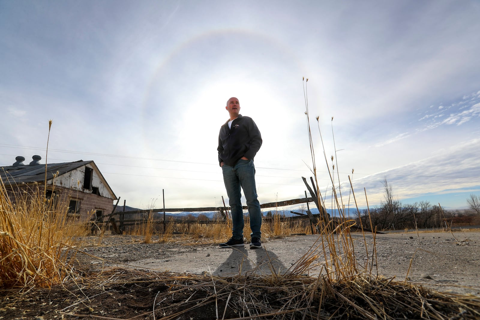 Spencer Cox, governor of Utah, stands outside by an old milking shed on his family’s farm in Fairview, Sanpete County. 