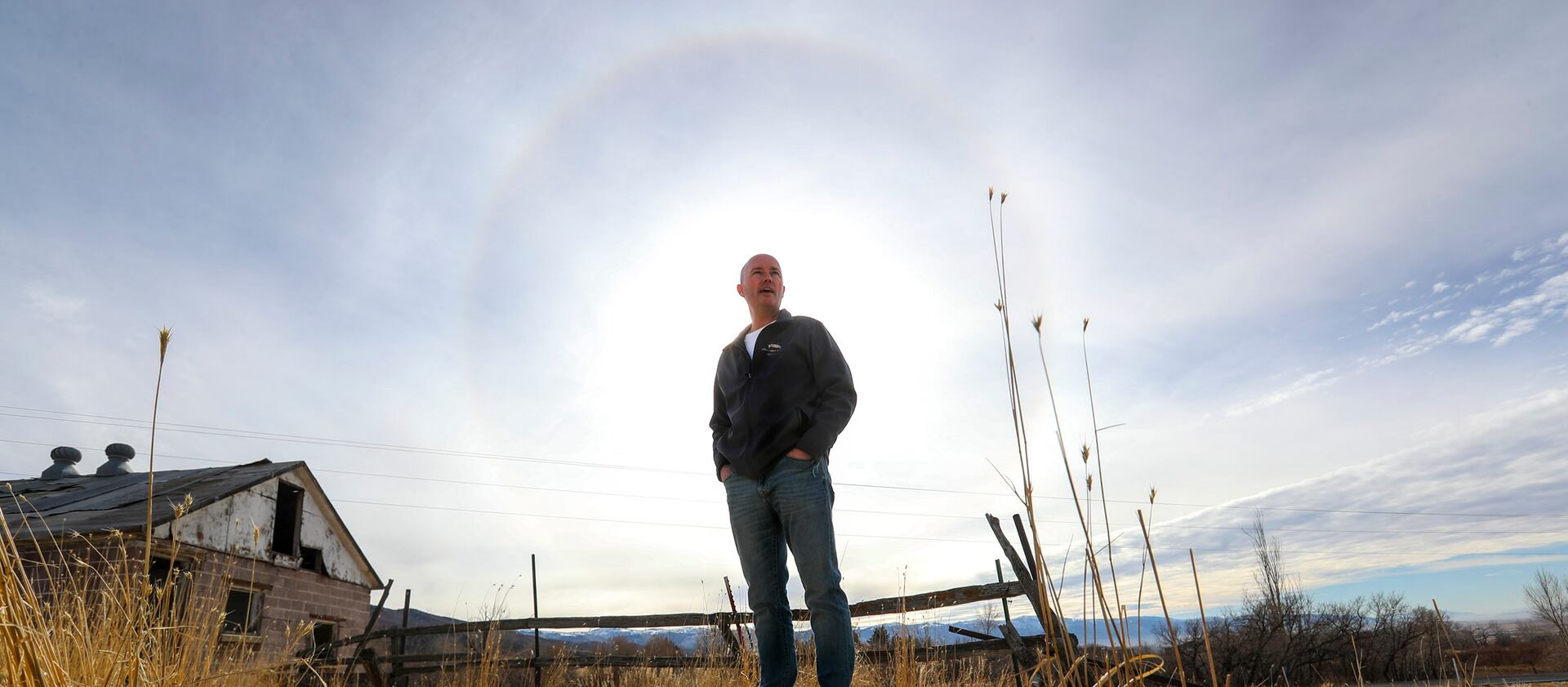 Spencer Cox, governor of Utah, stands outside by an old milking shed on his family’s farm in Fairview, Sanpete County. 