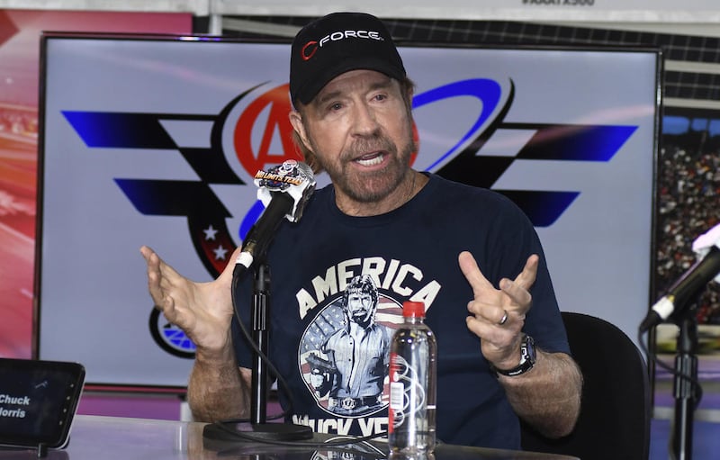 Chuck Norris speaks to reporters during a media availability before the NASCAR Sprint Cup Series auto race at Texas Motor Speedway in Fort Worth, Texas, Sunday, Nov. 6, 2016. Norris will take part in pre-race introductions. (AP Photo/Larry Papke)