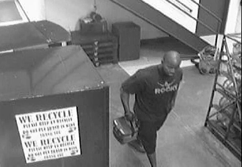 This black and white image from a surveillance video, provided by Manchester Police on Thursday, May 12, 2011, shows Omar Thornton carrying a lunch box and a handgun as he walks inside Hartford Distributors in Manchester, Conn., on Aug. 3, 2010. Thornton