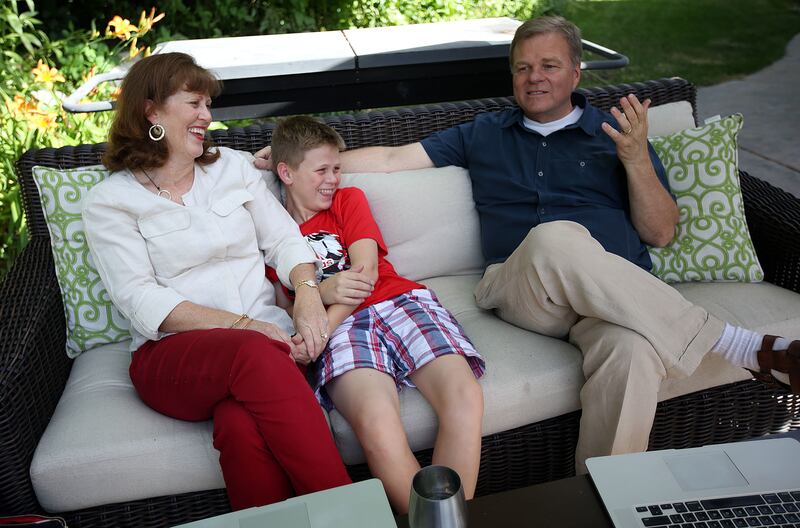 Jenny Ahlstrom, who is battling multiple myeloma, relaxes at home with son Neal and husband Paul in Sandy on Friday, June 29, 2018. Jenny and Paul Ahlstrom developed HealthTree, under the umbrella of the CrowdCare Foundation they first established, where