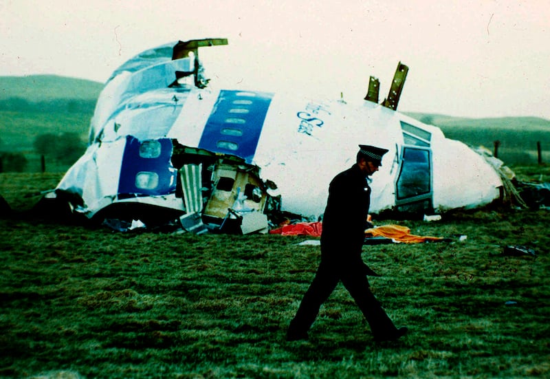 A police officer walks by the nose of Pan Am flight 103 near Lockerbie, Scotland, after a bomb aboard killed 270 people in 1988.