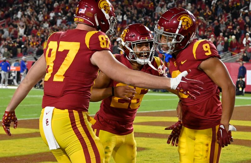 Southern California tight end Lake McRee, from left, defensive back Briton Allen (25) and wide receiver Michael Jackson III celebrate a touchdown against California during the first half of an NCAA college football game Saturday, Nov. 5, 2022, in Los Angeles.