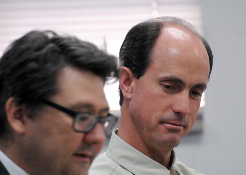 FILE - Seth Jeffs, right, the brother of Warren Jeffs, imprisoned leader of a polygamist sect, participates in a state water board meeting, Thursday, July 9, 2015, in Pierre, S.D.