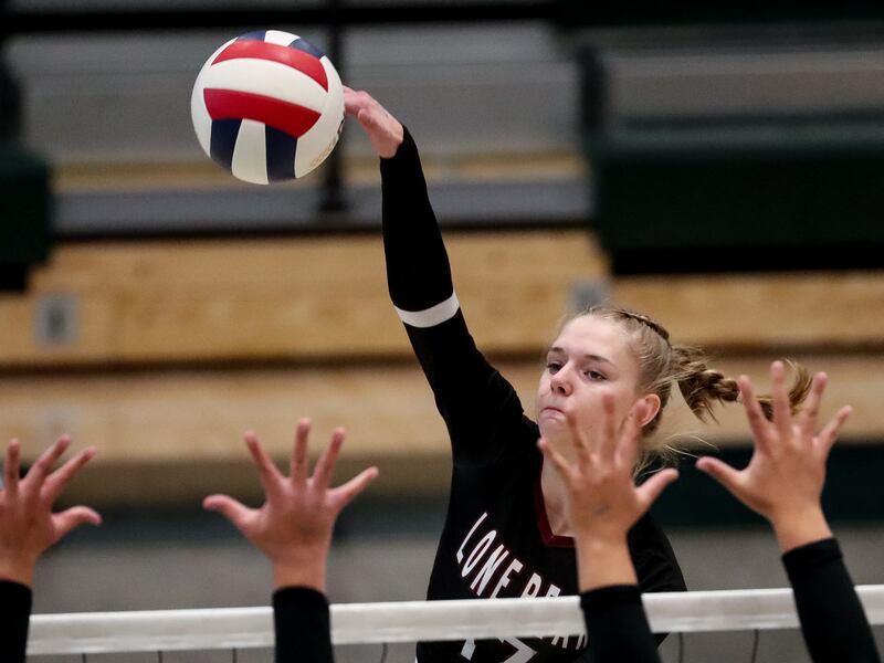Lone Peak’s Lauren Jardine hits the ball as the Knights and Copper Hills face off in the 6A volleyball championship match at Hillcrest High School in Midvale on Saturday, Nov. 7, 2020.