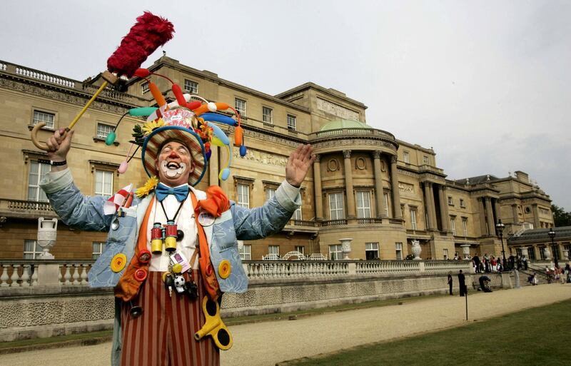 A clown performs during a children’s party at London’s Buckingham Palace, Sunday June 25, 2006. Buckingham Palace has remained quiet on the groundbreaking interview from the weekend